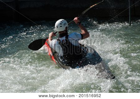 AUGSBURG, GERMANY - MARCH 28, 2017: Kayac slalom training to qualify for the Whitewater National Championships in Ottawa Canada 2017 using the course for the Summer Olympic Games in Germany in 1972.