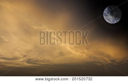 Dramatic and Artistic fantasy of sunset sky and clouds with Earth and stars.Image of Earth furnished by NASA.