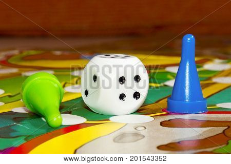 Blue and green plastic chips dice and Board games for children