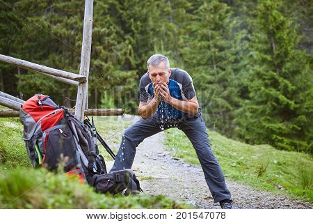 Hiking in the mountains with a backpack in the summer.