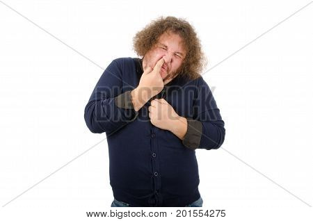 Man picks his nose. Fynny fat man.