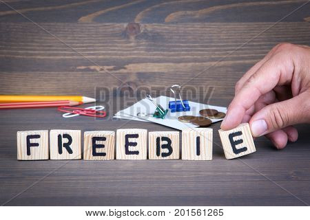 Freebie. Wooden letters on dark texture background