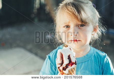 Beautiful Girl Five Years Eating Ice Cream In Nature