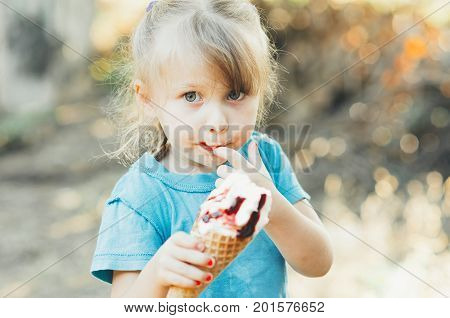 Beautiful Girl Five Years Eating Ice Cream In Nature