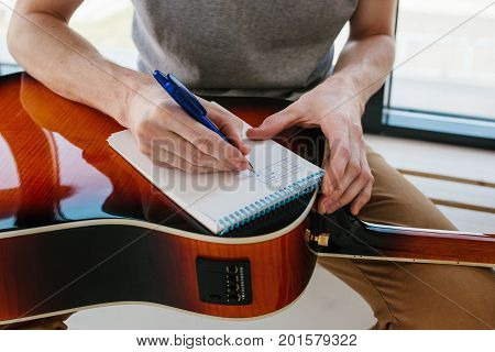 Learning to play the guitar. Music education and extracurricular lessons. Guitarist