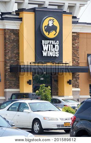 PLATTSBURGH USA - AUGUST 23 2017 : Buffalo Wild Wings restaurant and logo. Buffalo Wild Wings is an American casual dining restaurant and sports bar franchise