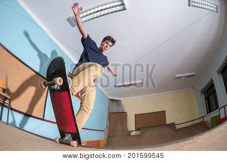Skateboarder Performing A Trick