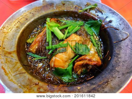Shrimps roasted with vermicelli in hot pot, Thai food, Thailand.