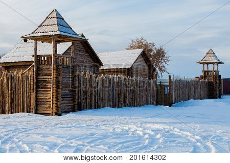 old wooden Fort, a stockade. winter near the lake