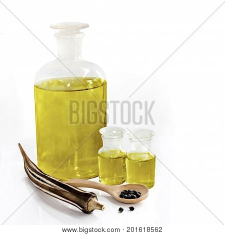 Abelmoschus esculentus / Okra seed and oil isolated on a white background.