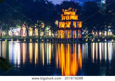 turte tower reflecting in the water at night, Hanoi, Vietnam