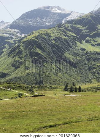 Alpine massif, beautiful Alpine canyon in Austria. Alpine Gastein Valley in summer. Mountains and pastures. Fresh air and healthy virgin nature. Excursional destination for hiking, vacation.