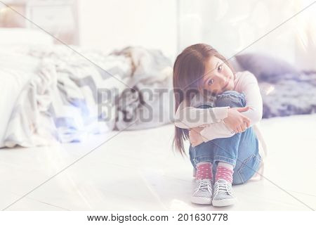 Sweet home. Gorgeous active bright girl spending time at home and enjoying her day while having a little rest