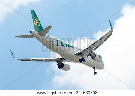Bangkok, Thailand. - April 8, 2017 : Plane of Spring Airlines or Airways on the sky landing to Suvanabhumi airport.