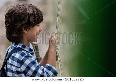 Child Looking Through Net
