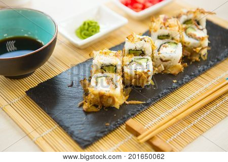 Maki Roll With Salmon, Popular Japanese Cuisine. Sushi Roll With Fish, Cream Cheese And Vegetables