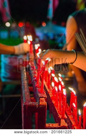 Burning red chinese candle in temple. New year ritual