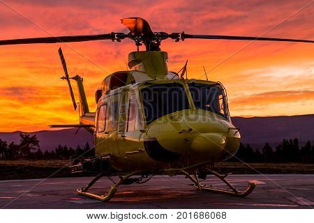 A front side wildfire helicopter view on a stunning sunset