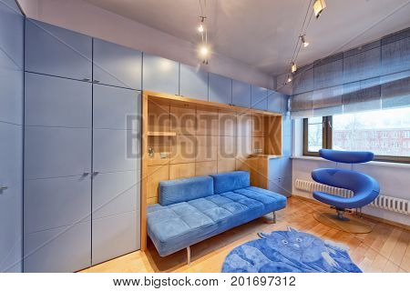 Interior children's bedroom for the boy in blue.