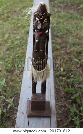 a wooden figures of people from tribes