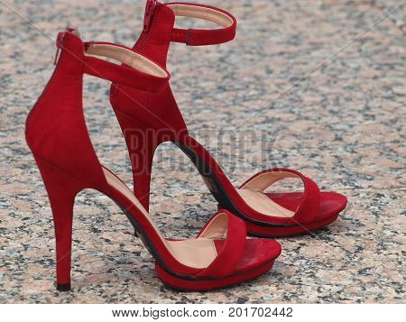 Red Stiletto Heels on marble walks in Williams Square, Las Colinas.
