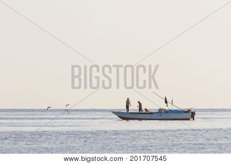 HURGADA EGYPT - October 10 2010. Fishermen fished with nets at sunset.