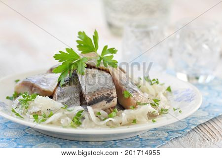 Salted Herring Fillet With Oil, Marinated Onion And Fresh Parsley