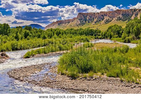 Wyoming river with mountain range in the background