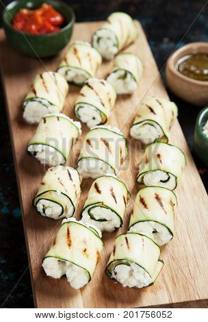 Grilled zucchini rolls filled with fresh cottage cheese