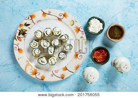 Zucchini rolls filled with fresh cottage cheese