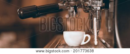 Coffee espresso. Espresso machine making coffee golden espresso flowing.