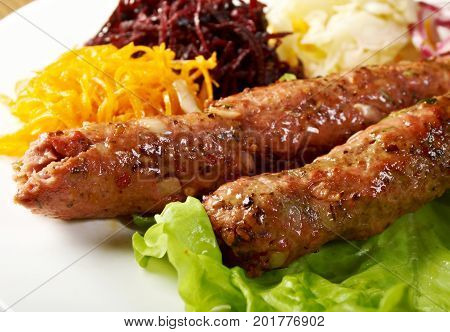 caucasian Luleh kebab with vegetable close up  homemade meal