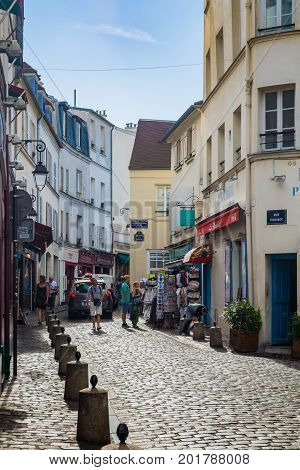 Paris France - August 14 2016: Montmartre is a large hill in Paris. Montmartre is primarily known for the white-domed Basilica of the Sacré-C