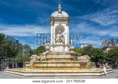 Paris France - August 14 2016: The Fountain Saint-Sulpice or Fountain of the Four Bishops. It presents the statues of four bishops one on each of its sides