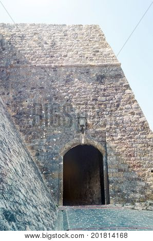 Main entrance to the Stari Grad of Ulcinj Montenegro. The gate of fortress in the Old town in a sunny summer day.