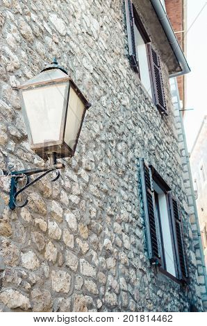 Old narrow street in Stari Grad of Ulcinj Montenegro. The fortress in the Old town in a sunny summer day.