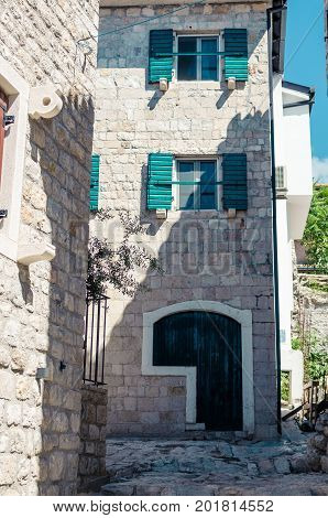 Old narrow street in Stari Grad of Ulcinj Montenegro. The fortress in the Old town in a sunny summer day.