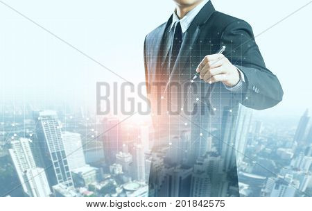 businessman present increasing graph with city background, business growth