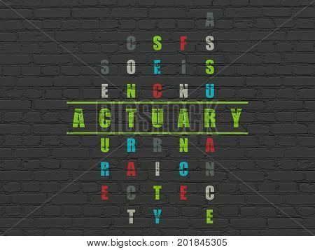 Insurance concept: Painted green word Actuary in solving Crossword Puzzle