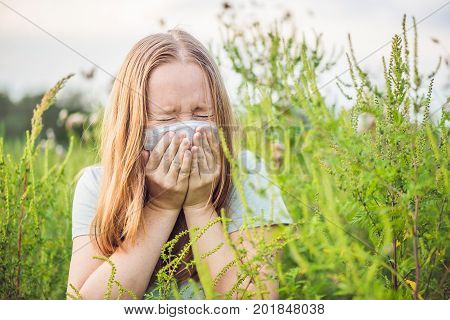Young Woman Sneezes Because Of An Allergy To Ragweed