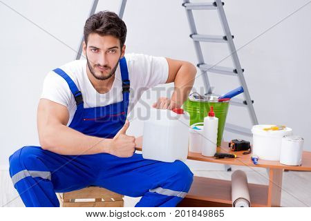 Repairman doing renovation repair in the house with paper wallpa