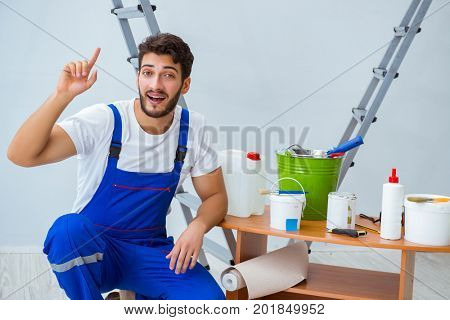 Repairman doing renovation repair in the house with paper wallpa