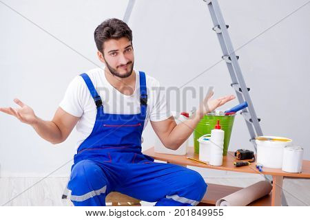 Repairman doing renovation repair in the house with paper wallpa
