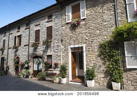 Nibbiano (Piacenza Emilia-Romagna Italy): old typical house exterior with plants and flowers