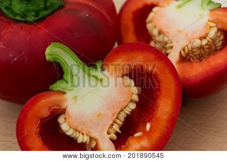 Sweet and fresh red bell pepper in cut with seeds.