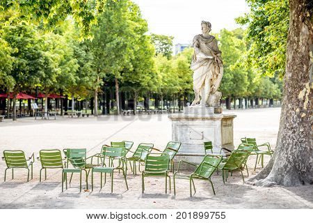 Famous green metal chairs at the Tuileries park in Paris