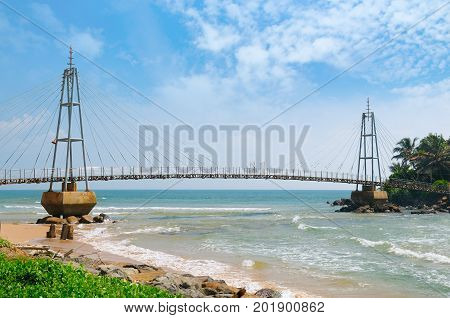 Bridge to the island with a Buddhist temple Matara Sri Lanka