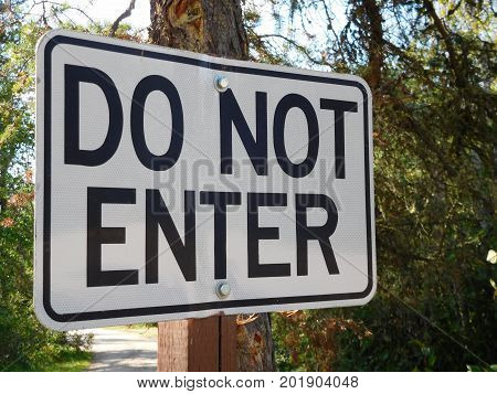 Do Not Enter Sign With Trees in The Background.