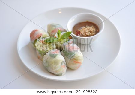 Healthy Fresh Spring Rolls. A see-through rice paper rolled around pork