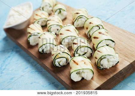 Grilled zucchini rolls filled with fresh cottage cheese